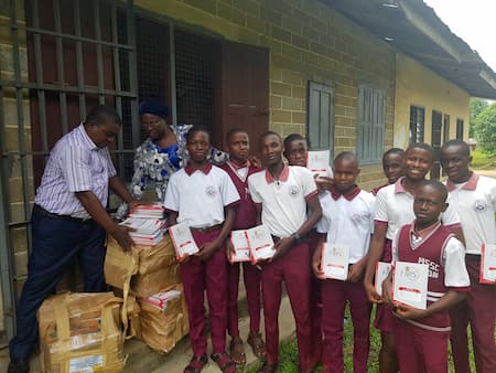 Exercise books donated to the students of MSSC Oron by their mentor