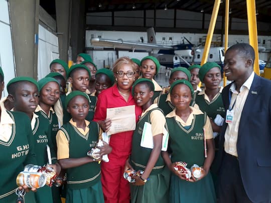 Kafayat and the students of her adopted school during an excursion to the Mobil Air Strip