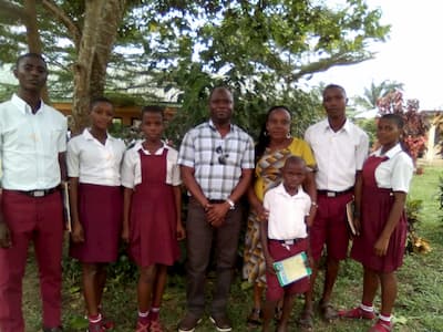 Mr. Maurice Asuquo and the students of his adopted school Essien Itiaba Community Secondary School