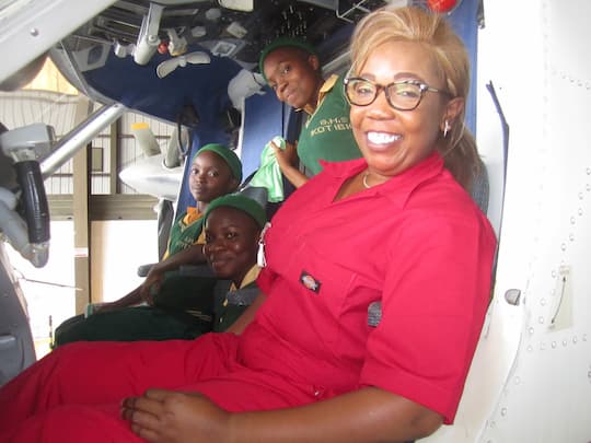 Ms. Kafayaat and some of her students during an excursion to the Mobil Air Strip