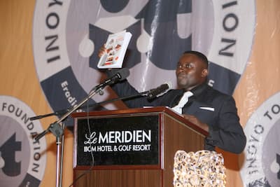 Mr Stephen Abia presenting an English Language Text Book dedicated to the Foundation
