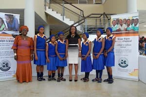 Students of Adiaha Obong Secondary Commercial School, Nwaniba, Uyo LGA and a representative of their mentor Emem Dominic (c)