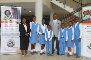 Students of Nigerian Christian Secondary School, Ukpom Abak, Abak LGA and their mentor, Aniekan Etiebet (c)