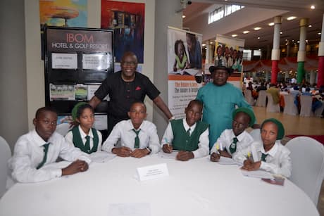 Mr. Etim Amana and the students of his adopted school
