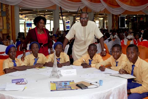 Mr. Usen Udoh and the students of his adopted school St. Mary's Sec. Com. Sch Ikot Nseyen