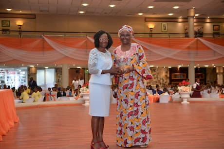 Mrs. Glory Ukpong presenting the Best Principal's Award onbehalf of Bassey Ukpong Udo Foundation to the winner Mrs. Elizabeth U. Michael of Holy Trinity College, Mbiakong Uruan 