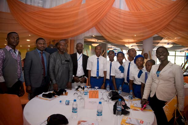 Mr. Esumo Effiong and the students of his adopted school Com. Sec. Sch. Okuko