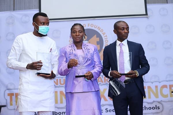 Award beneficiaries Economics Ekaette Akpan, Aniekan Udo and Kevin Kevin. Award was sponsored by Anchor Insurance