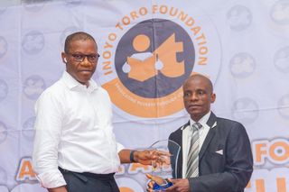 Eno Monday Utio Second Prize Winner, Biology Receiving Award From Sir Charles Udo, Hon. for Environment AKS