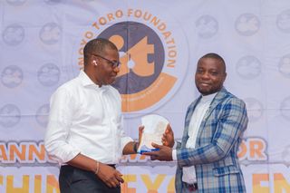 Idorenyin Oscar Jacob, First Prize Winner, Biology Receiving Award From Sir Charles Udo, Hon. for Environment AKS