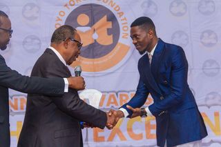 Prof. Gregory Akpan, Rep. Boda Services Ltd Presented Award to the Second Prize Winner, English Language Victor Collins Akpan